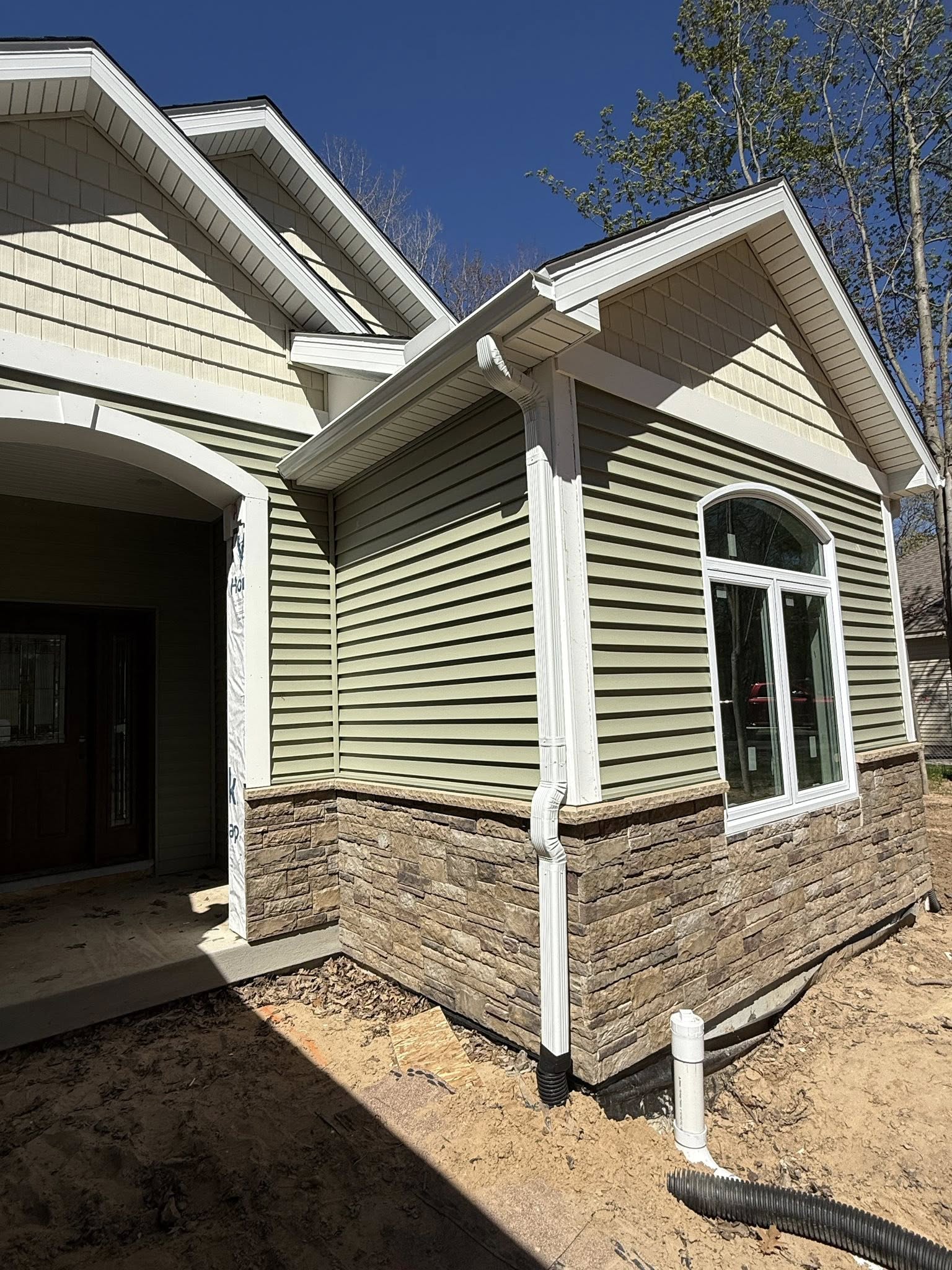 New downspout installation on a residential home